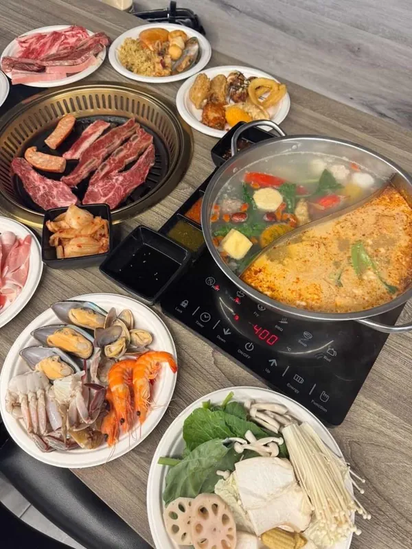 Korean BBQ, twin hotpot, seafood and sides all on one table